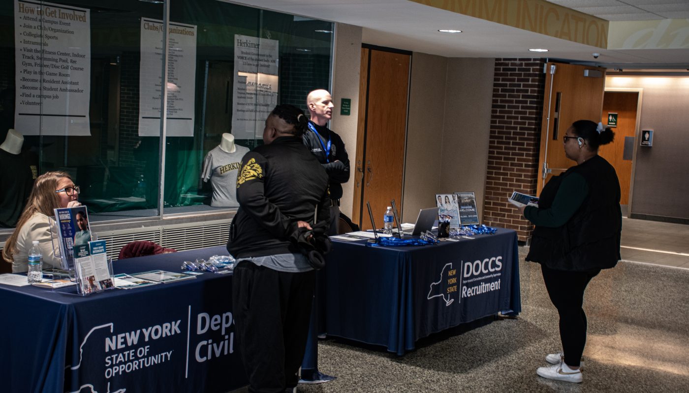 Students stopping by informational table