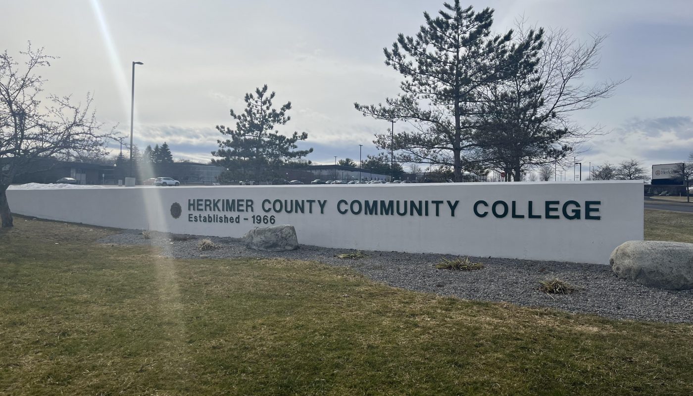 Landscape photo of the Herkimer County Community College sigh in front of the school.
