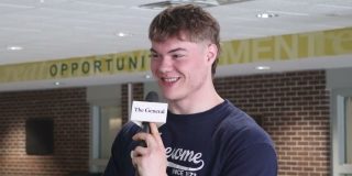 Question of the Week Host Holding Mic