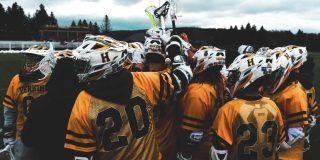 Lacrosse team meets in huddle